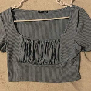 blue lined short crop top with a puffy front area